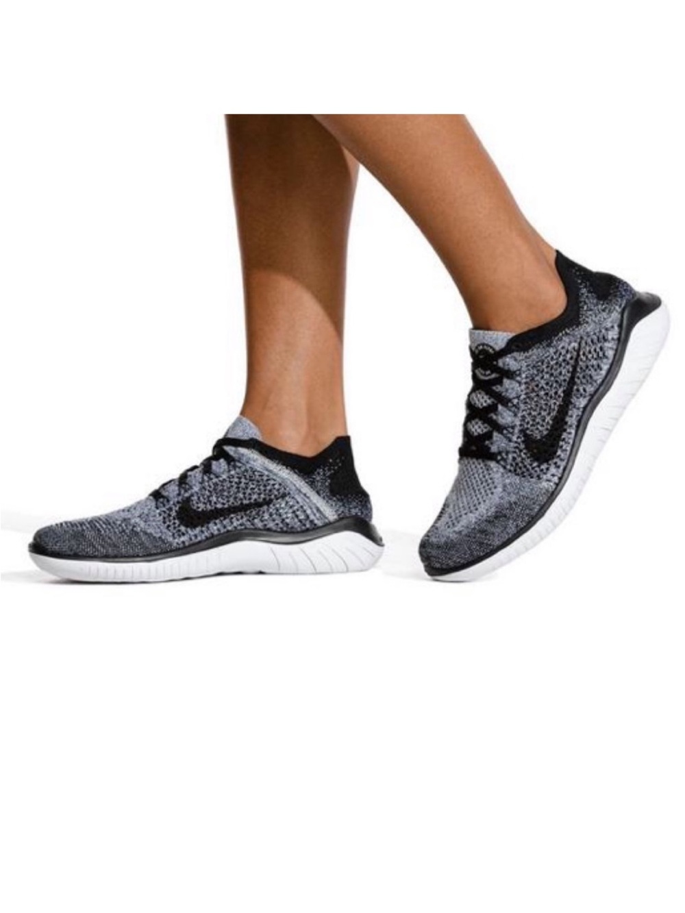 Nike Women Flyknit Running Sneakers in Black and White